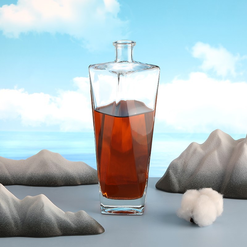 engraved whisky glass and bottle