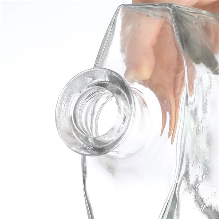 Simple Golden-Lidded Transparent Glass Bottle